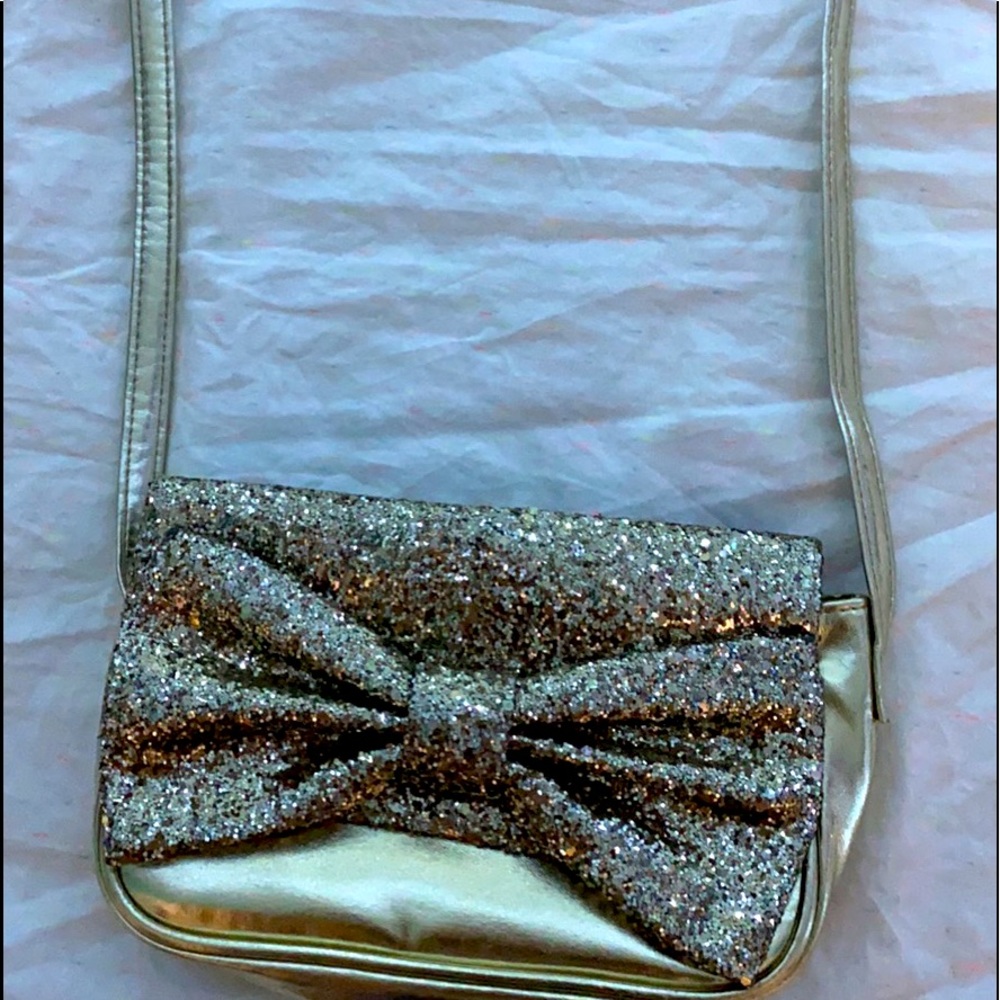 est. 1989 PLACE. Gold sparky purse. The sparkles don’t come off. Good condition.